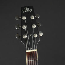 Load image into Gallery viewer, Guitar headstock with 'The Heritage' branding on a dark background